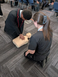 Year 10 Trinity student practising CPR.